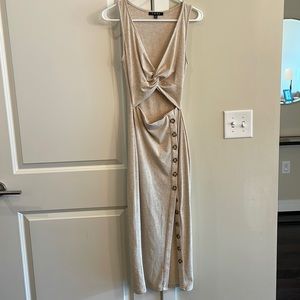 Fore beige dress with twist top, open midriff, and button detail